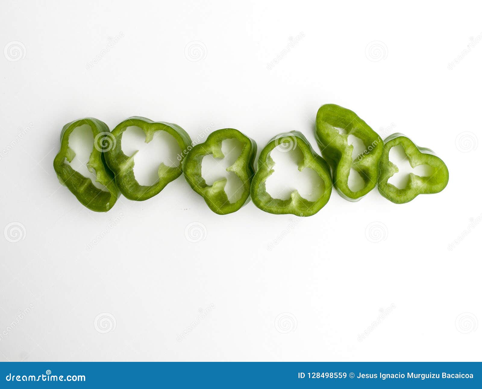 aerial view of a row of slices cut from a green pepper