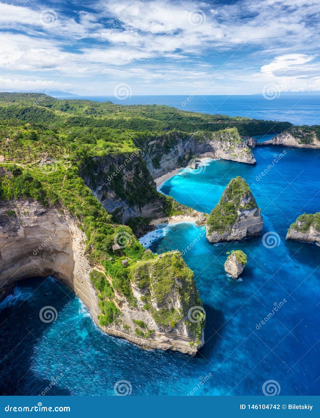 aerial view at sea and rocks. turquoise water background from top view. summer seascape from air. atuh beach, nusa penida, bali, i