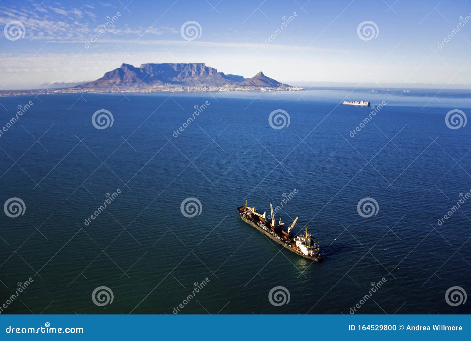 aerial view of ship in table bay with table mountain