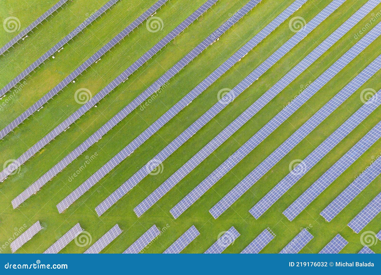 aerial view of solar power plant on green field. electric panels for producing clean ecologic energy. solar cell field. megawatt
