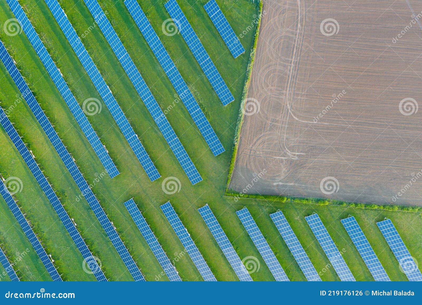 aerial view of solar power plant on green field. electric panels for producing clean ecologic energy. solar cell field. megawatt
