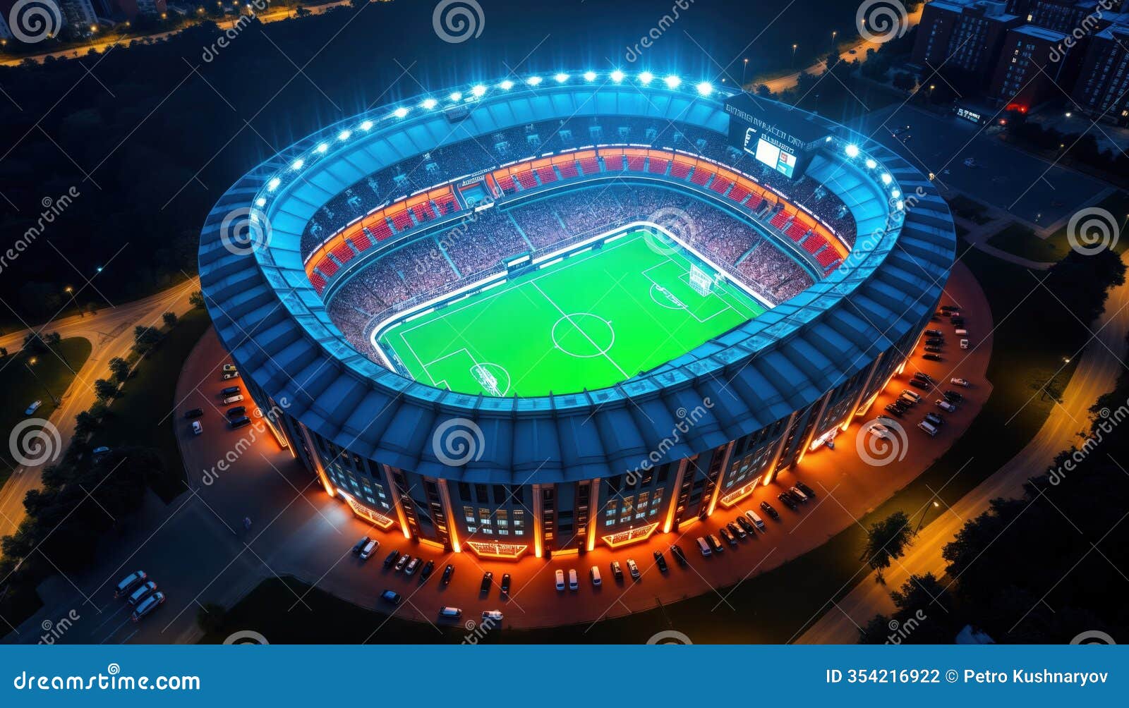 aerial view of stadium at night. bright lights illuminate arena, field. holographic replays shown on field. many spectators in