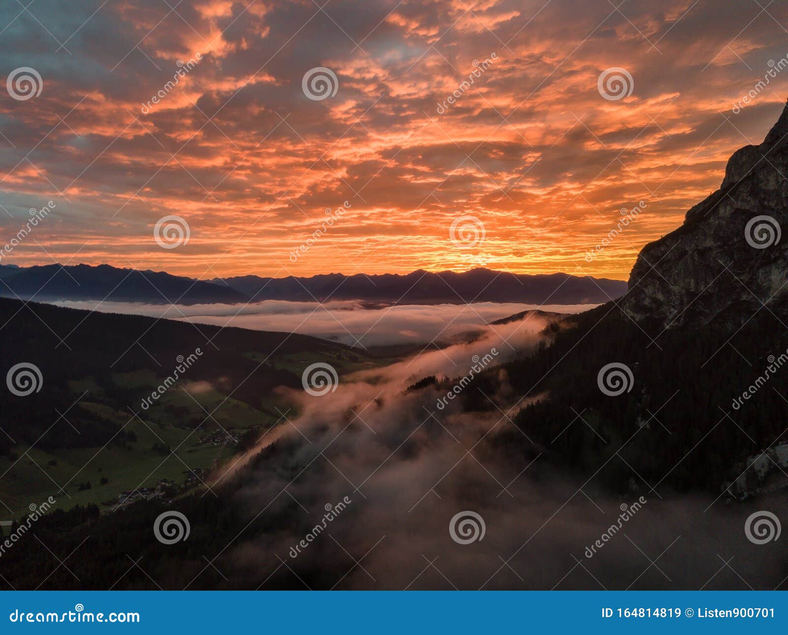 Aerial View Of The Sunrise From The Mountain In Dolomites Italy Drone View With Morning Glow And Mist In The Valley Stock Image Image Of Dramatic Aerial