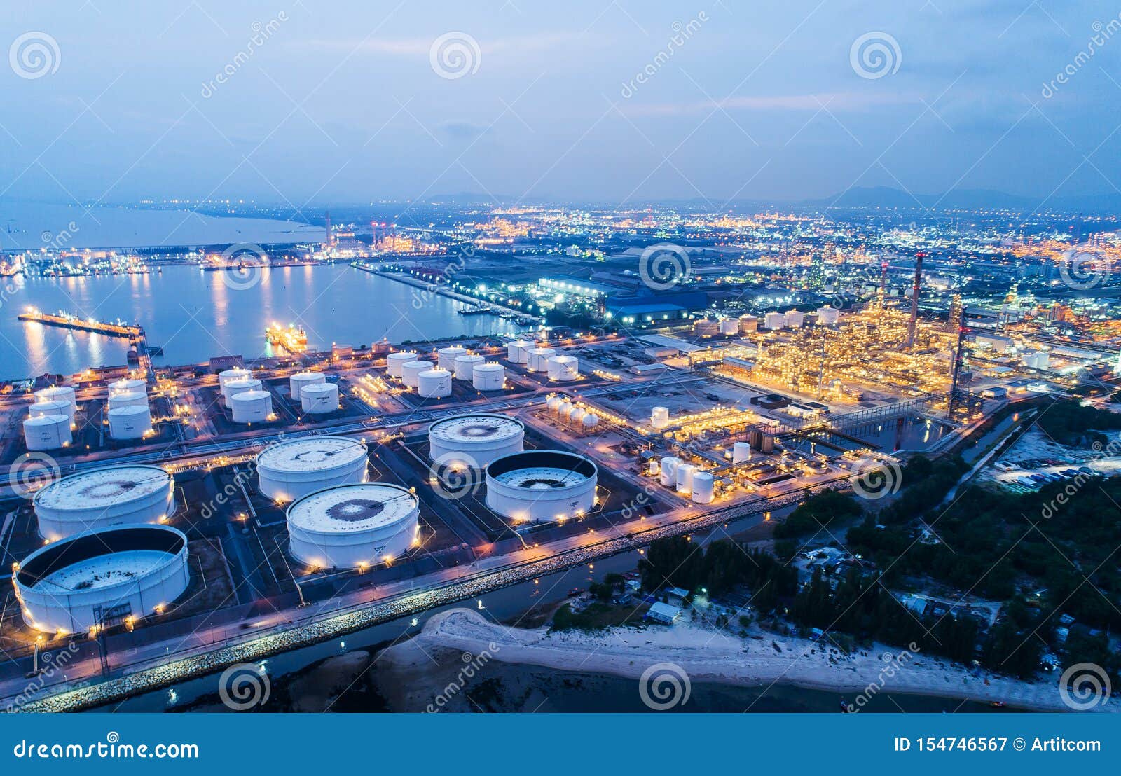 aerial view or top view night light oil terminal is industrial facility for storage of oil and petrochemical.