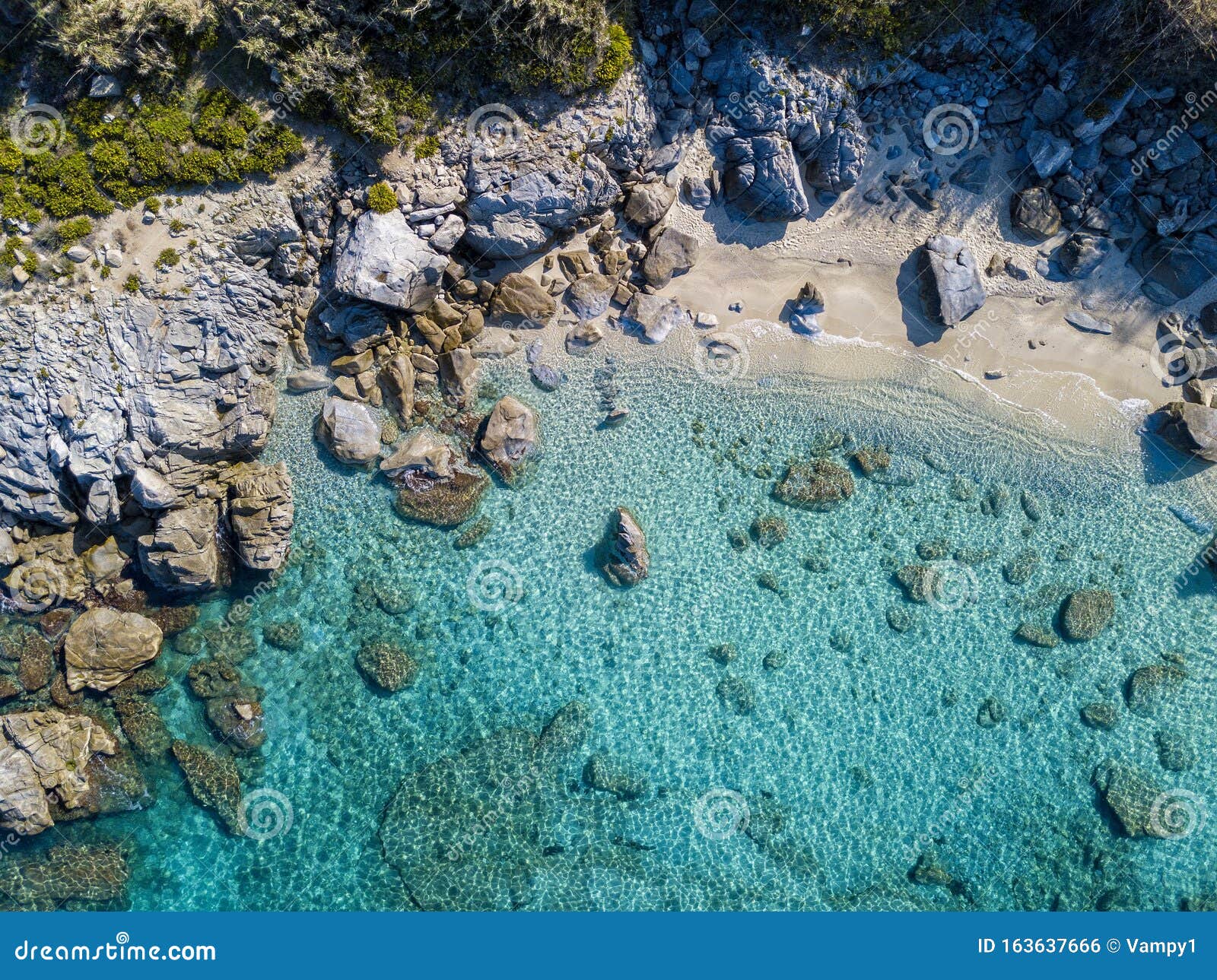 aerial view of tropea beach, crystal clear water and rocks that appear on the beach. calabria, italy. swimmers, bathers floating