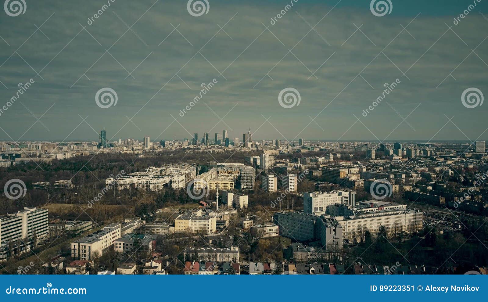 aerial view of warsaw suburbs and distant dowtown skyline on sunny spring day, poland
