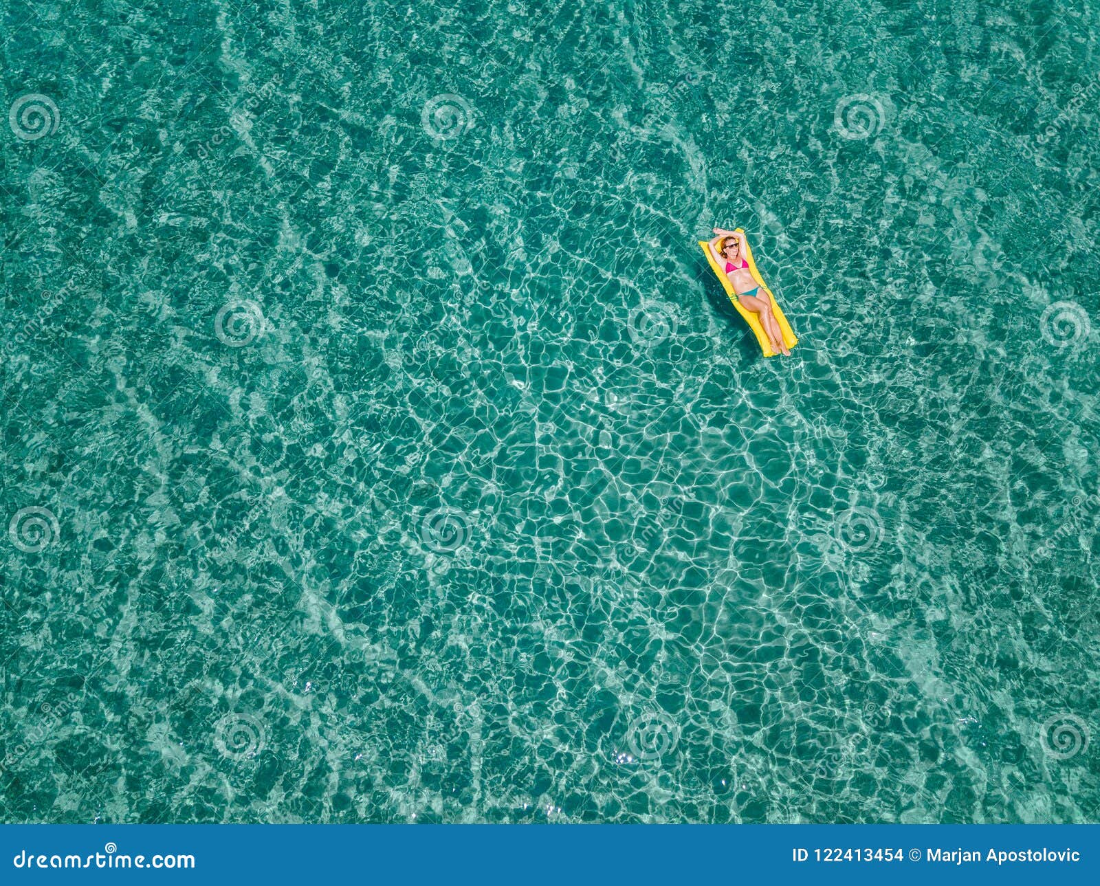 Aerial View of Woman Floating on the Water Mattress in the Sea Stock ...