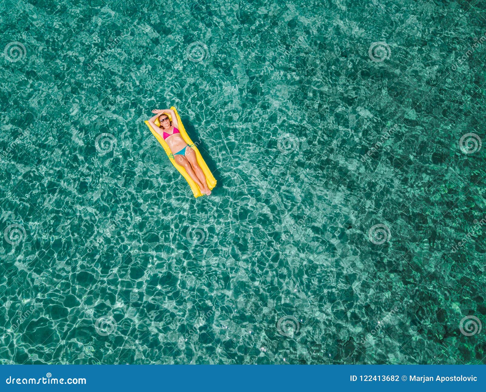 Aerial View of Woman Floating on the Water Mattress in the Sea Stock ...