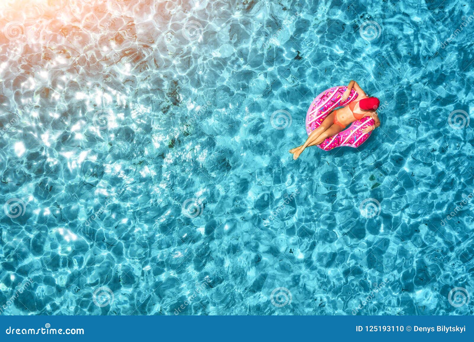 Aerial View of Woman Swimming on Donut Swim Ring in the Sea Stock Photo ...
