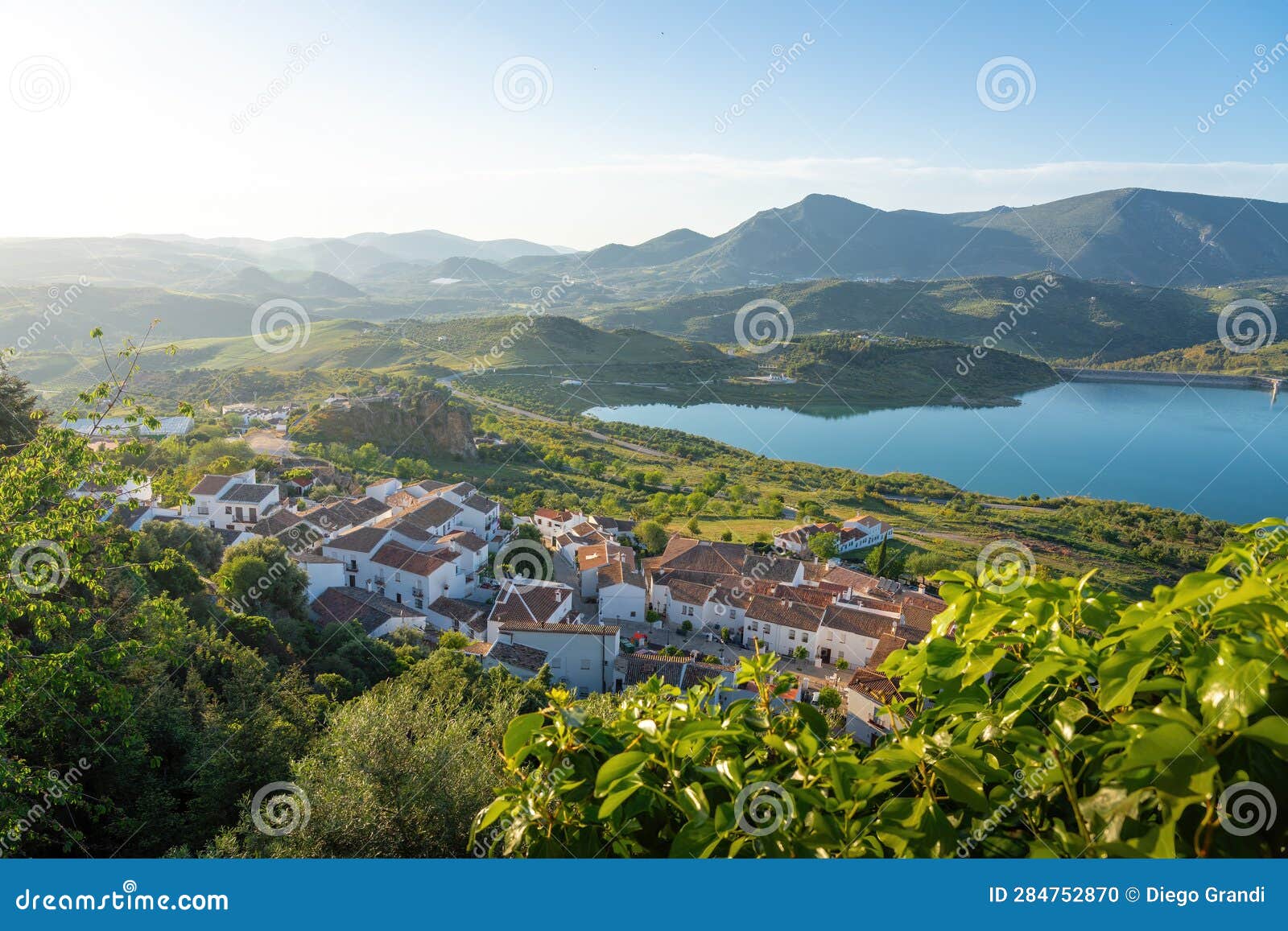 aerial view of zahara de la sierra and reservoir lake - zahara de la sierra, andalusia, spain