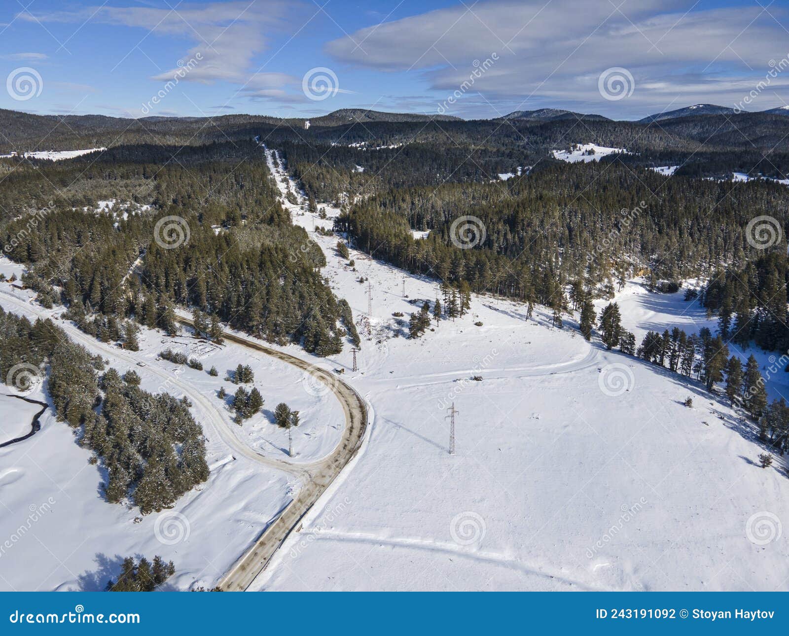 aerial winter view of beglika reservoir covered with ice, bulgaria
