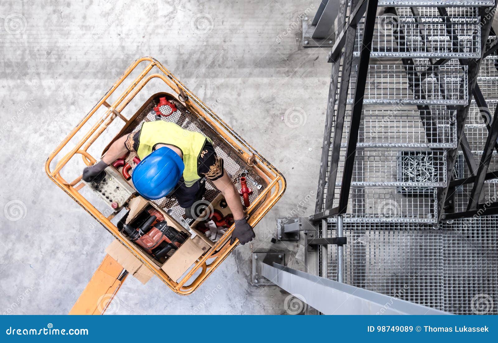 aerial of a worker on a cherry picker