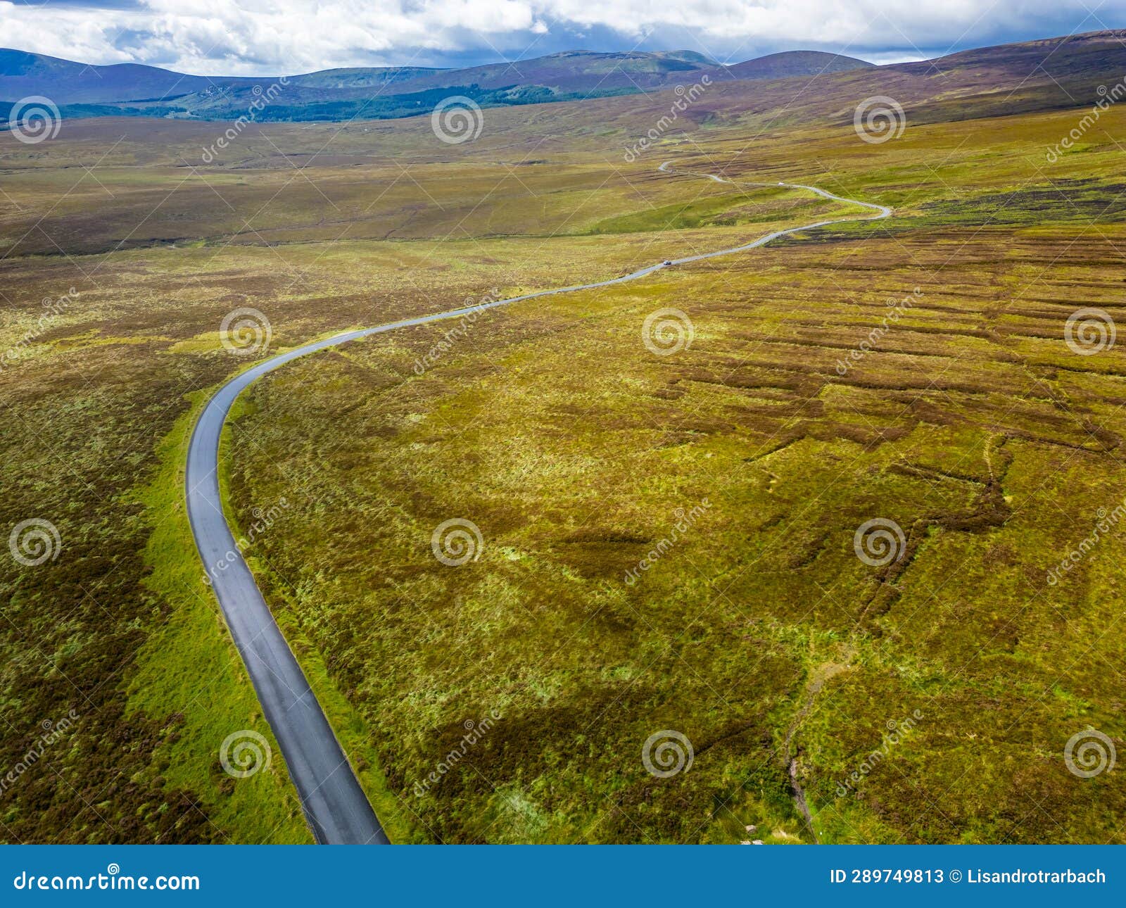 aerialview of road, bogs with mountains in background in sally gap