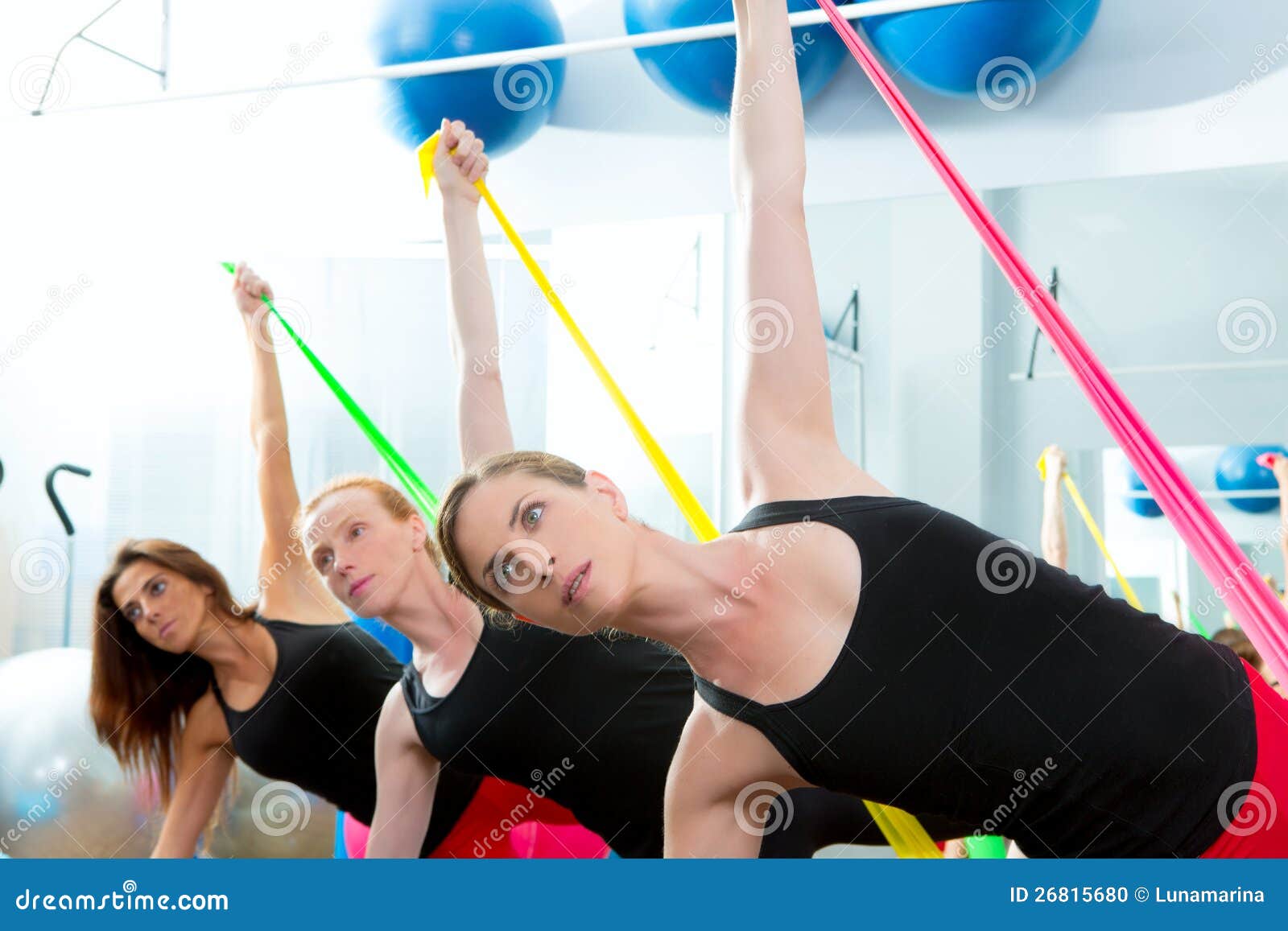 Aerobics Pilates Women with Rubber Bands in a Row Stock Photo Image