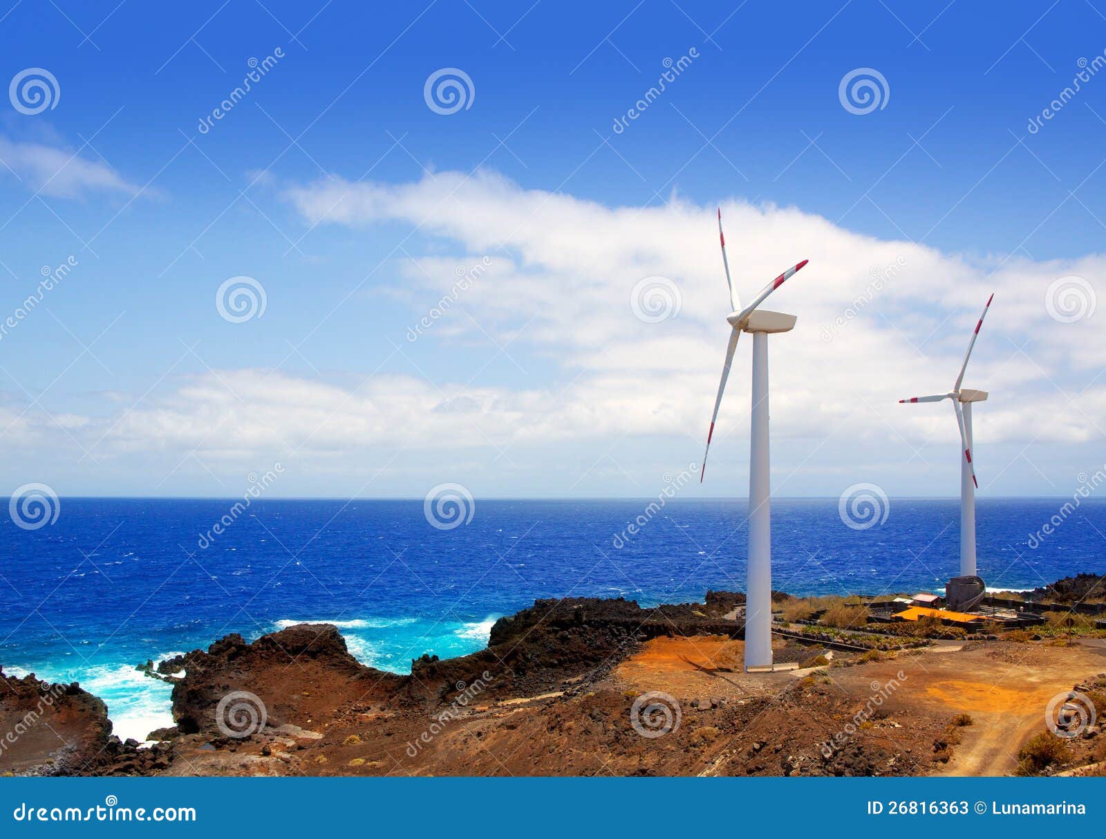 aerogenerator windmills in front of ocean sea
