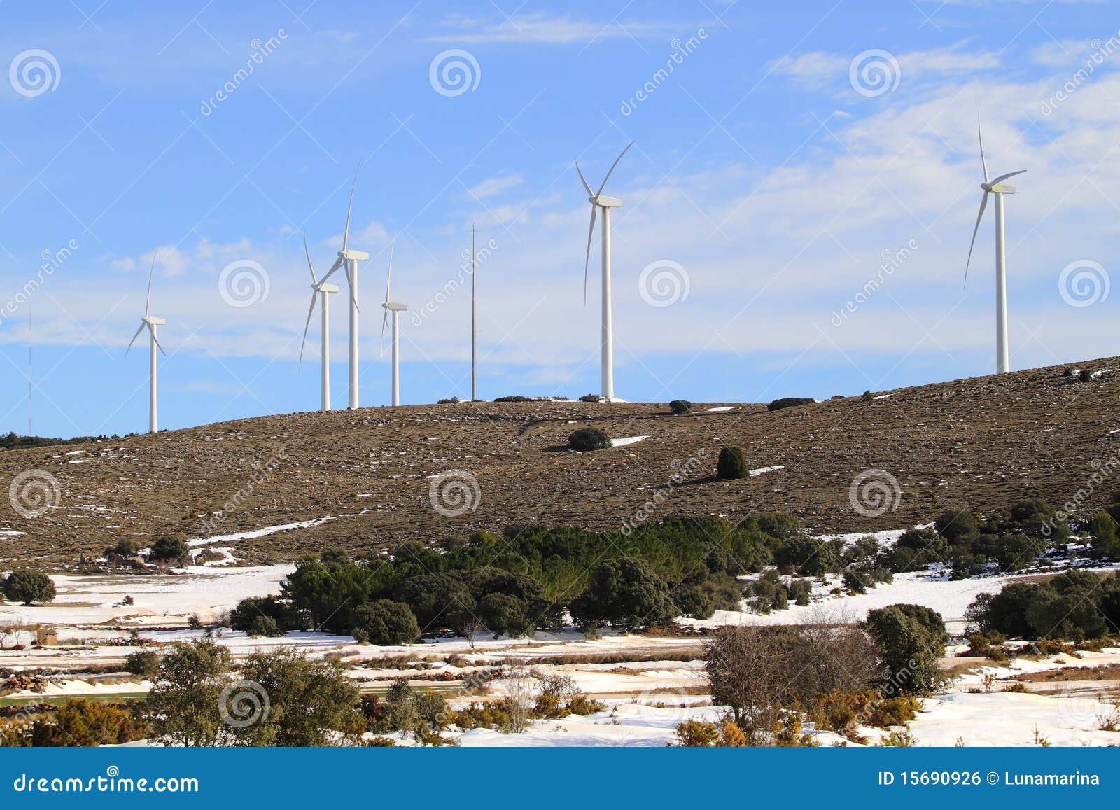 aerogenerator windmills on snow mountain