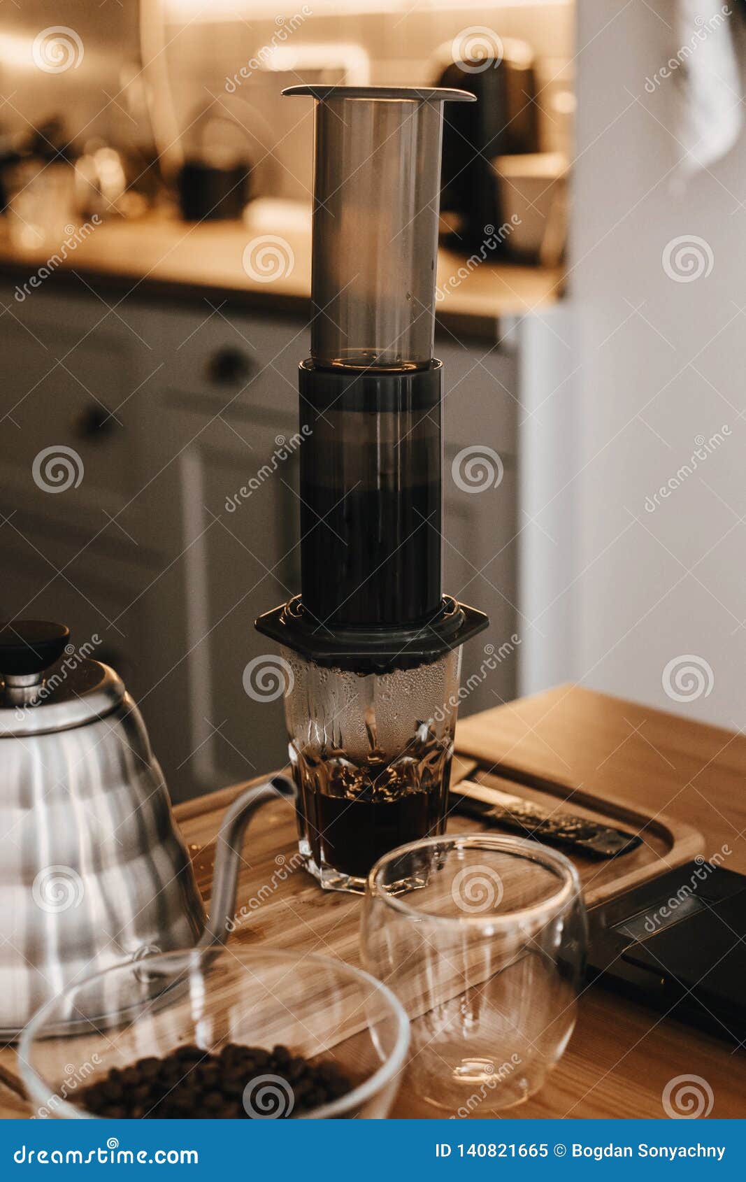 Aeropress and Glass Cup, Scales, Manual Grinder, Coffee Beans, Kettle on  Wooden Table. Professional Barista Preparing Coffee by Stock Image - Image  of espresso, filter: 140821665