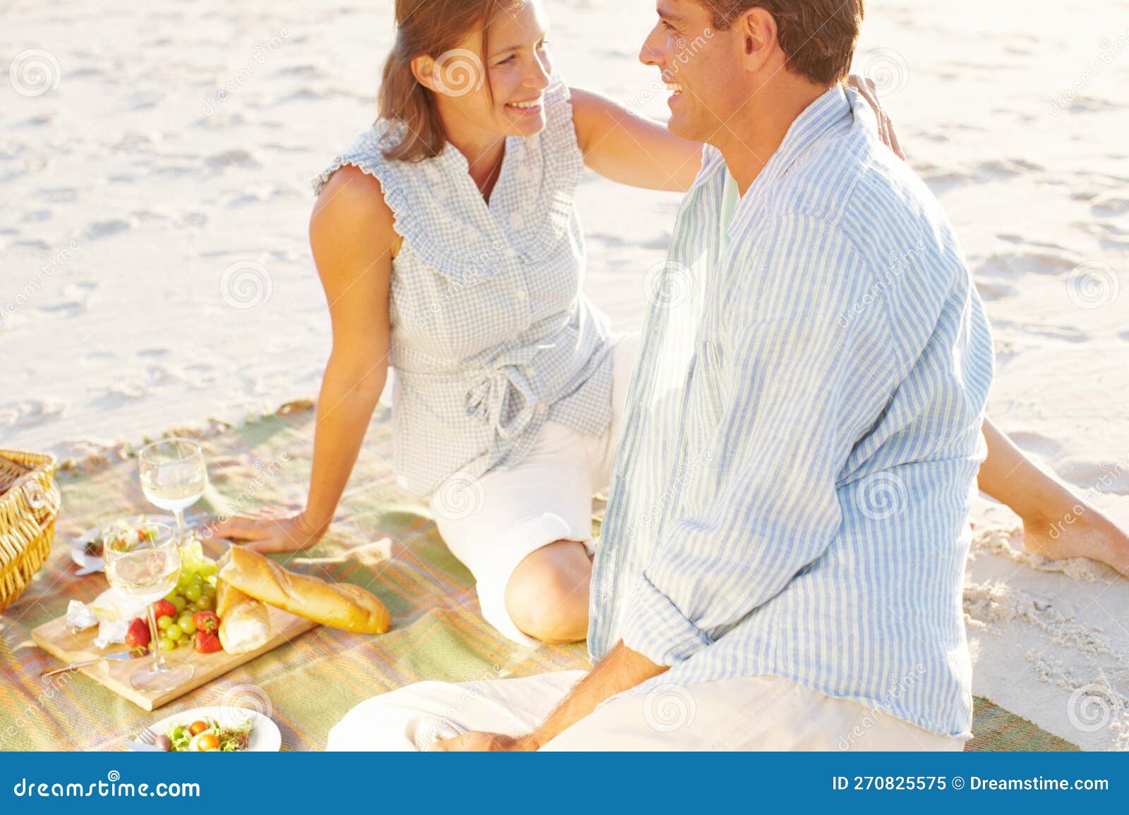 Affection at Sunset. a Devoted Couple Enjoying a Romantic Picnic on the