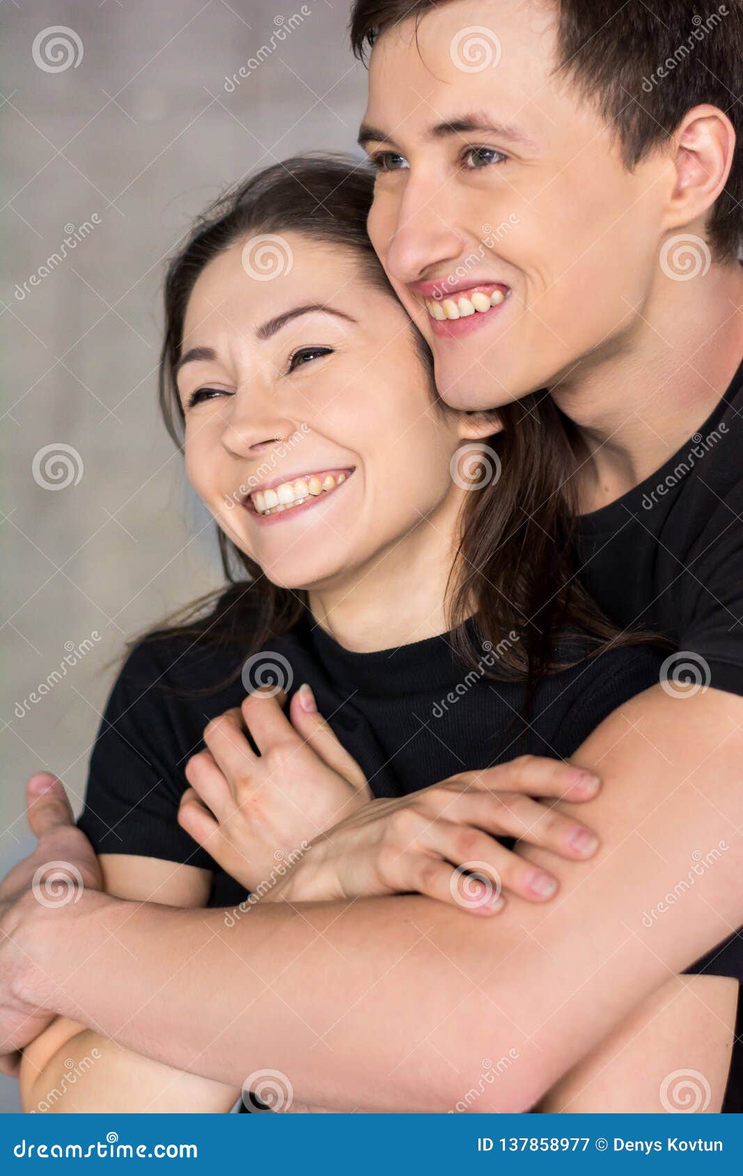 affectionate couple hugging close up.