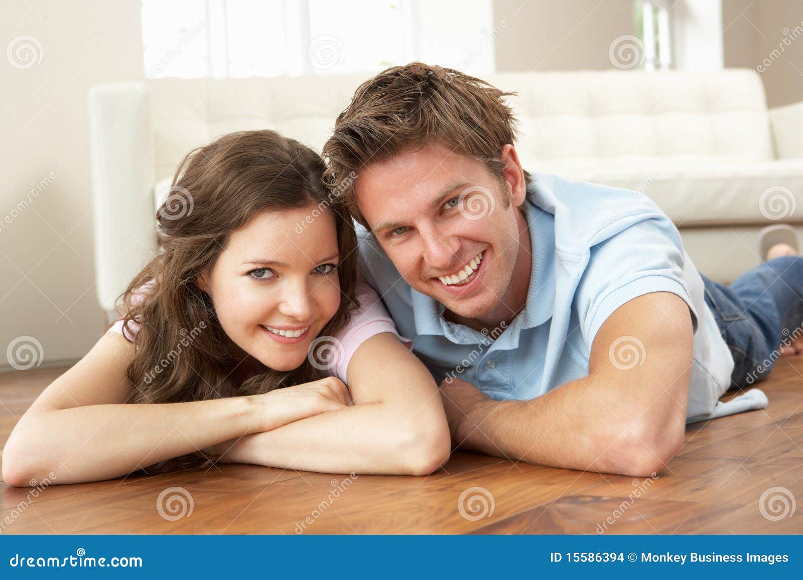 affectionate couple relaxing at home together