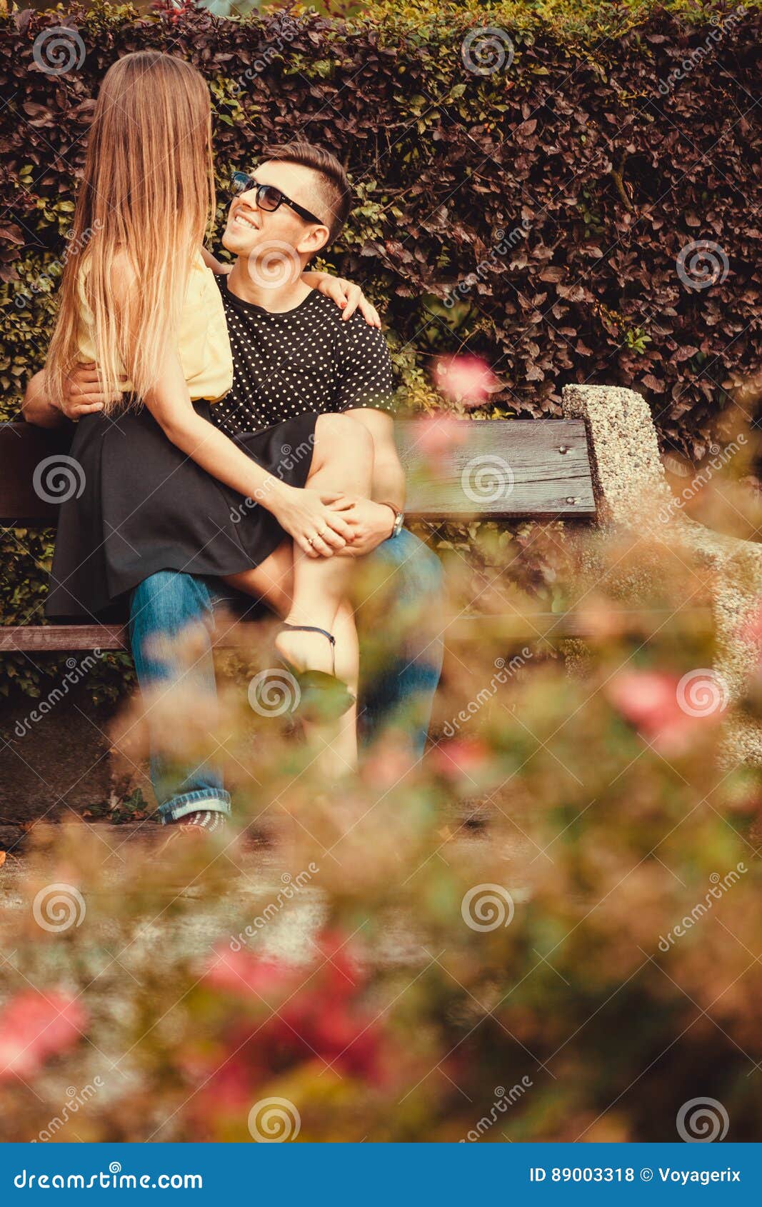 Girl Sitting On Boy Lap