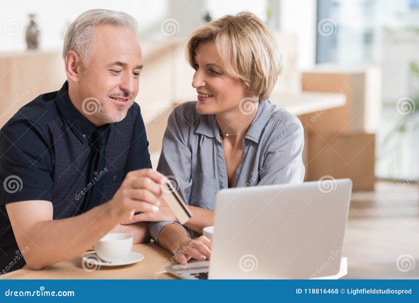 affectionate couple wanting to buy something online and pay