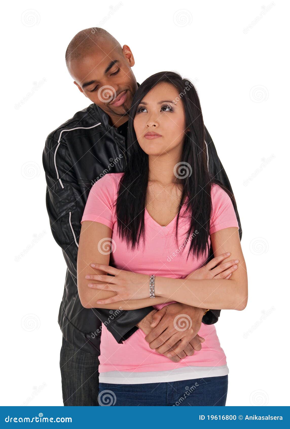 affectionate guy embracing sceptical-looking girl