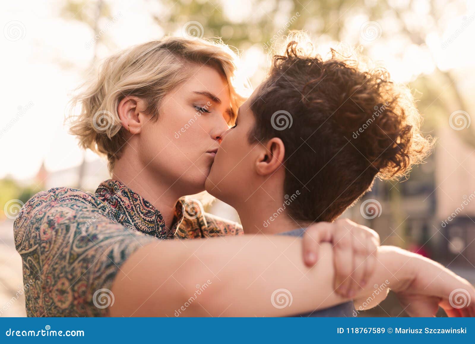 Affectionate Young Lesbian Couple Sharing a Kiss in the City Stock Image