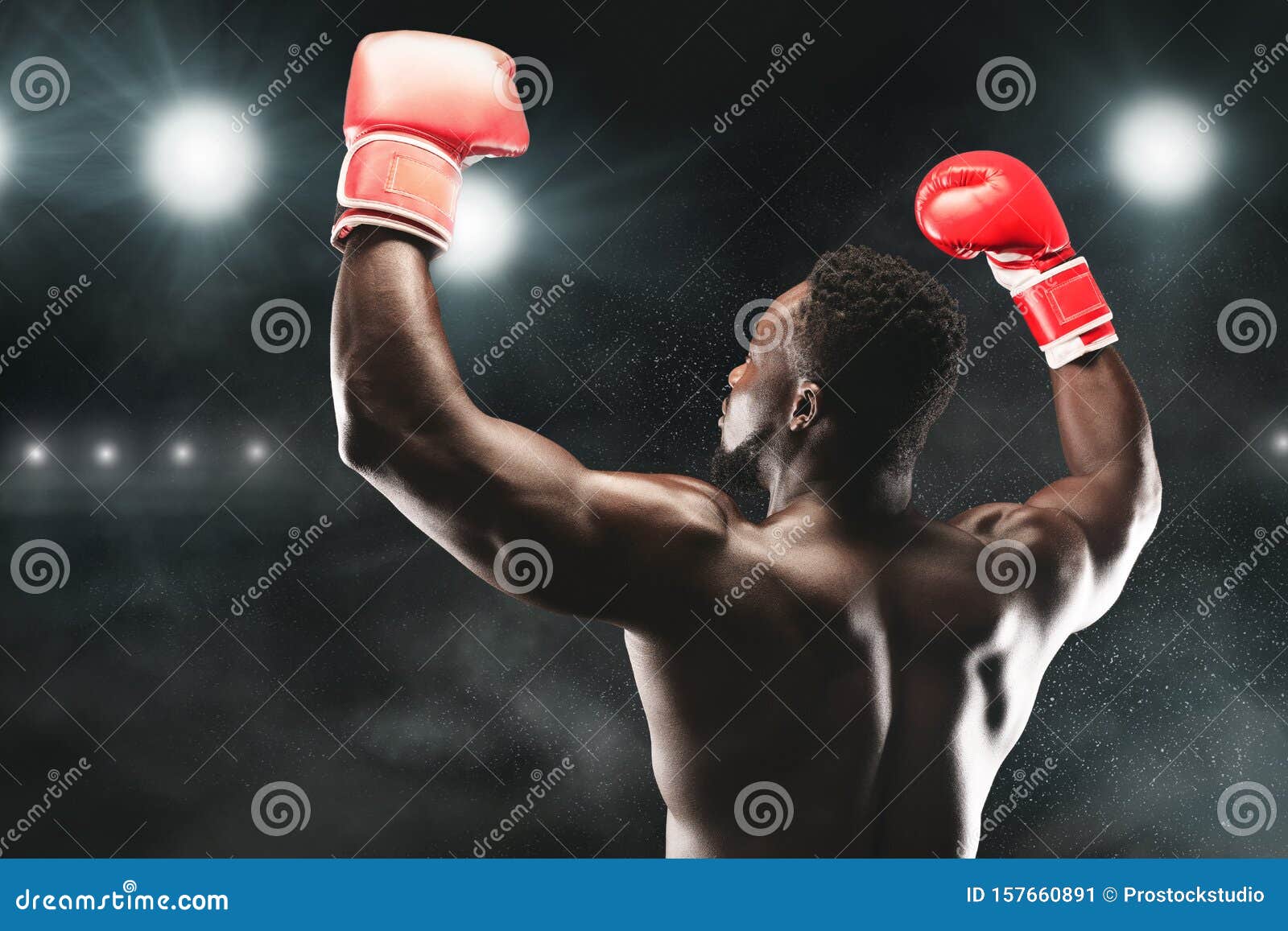 African American Boxing Champion Raising Hands Up Stock Image