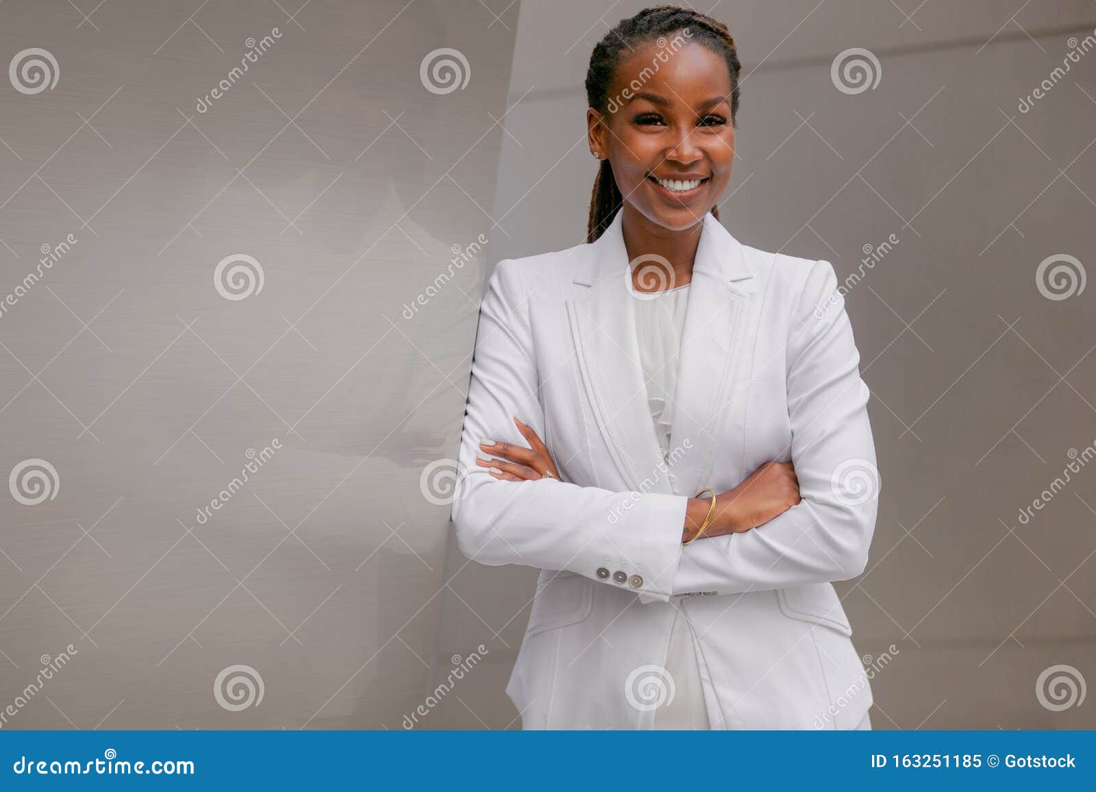 african american business woman smiling confidently, cheerful, accomplished, proud, successful, at financial workplace building