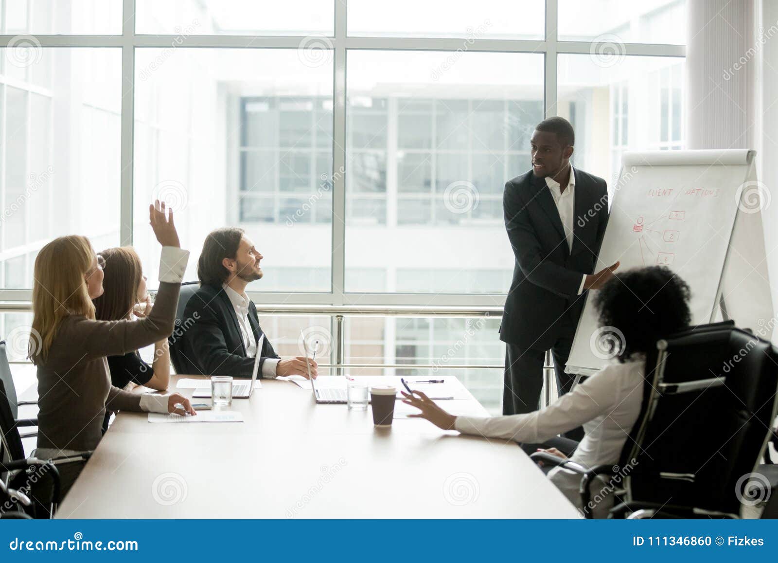 African American Businessman Giving Presentation Answering Quest Stock