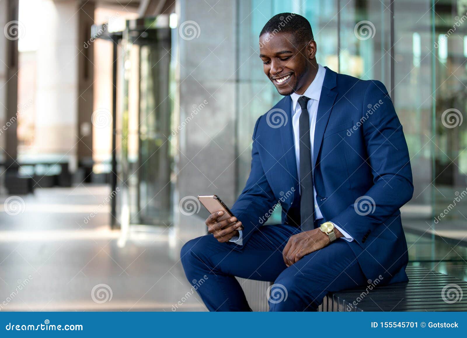 african american businessman smiling cheerful, using cell phone at office building, internet, broadband, 5g, copy space