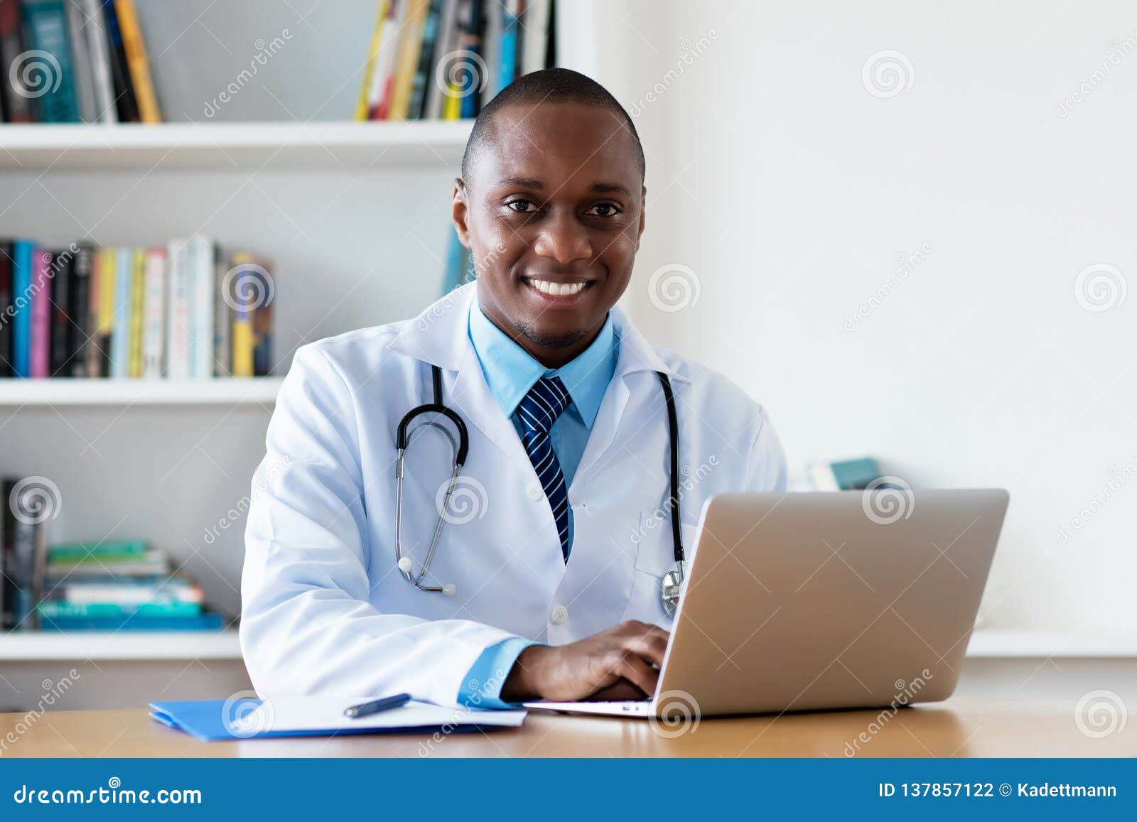 african american chef physician working at computer