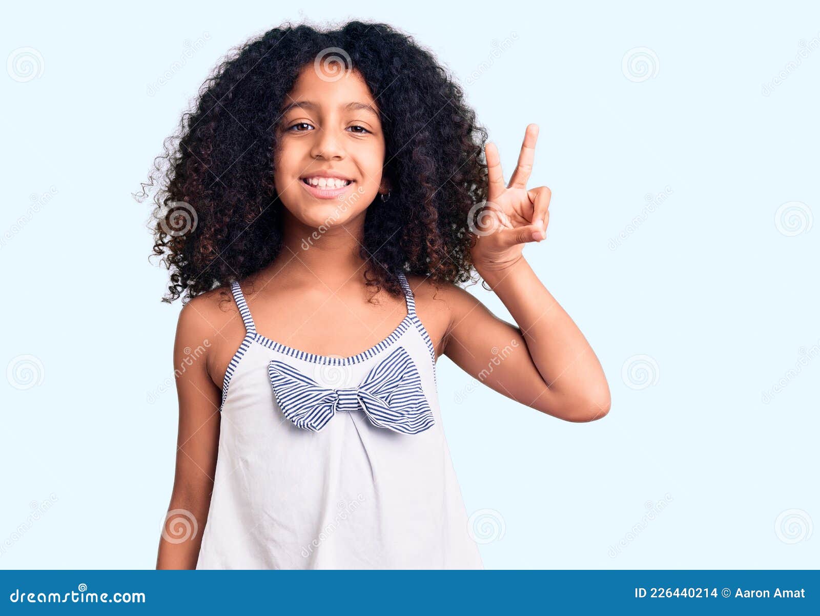 African American Child with Curly Hair Wearing Casual Clothes Smiling ...