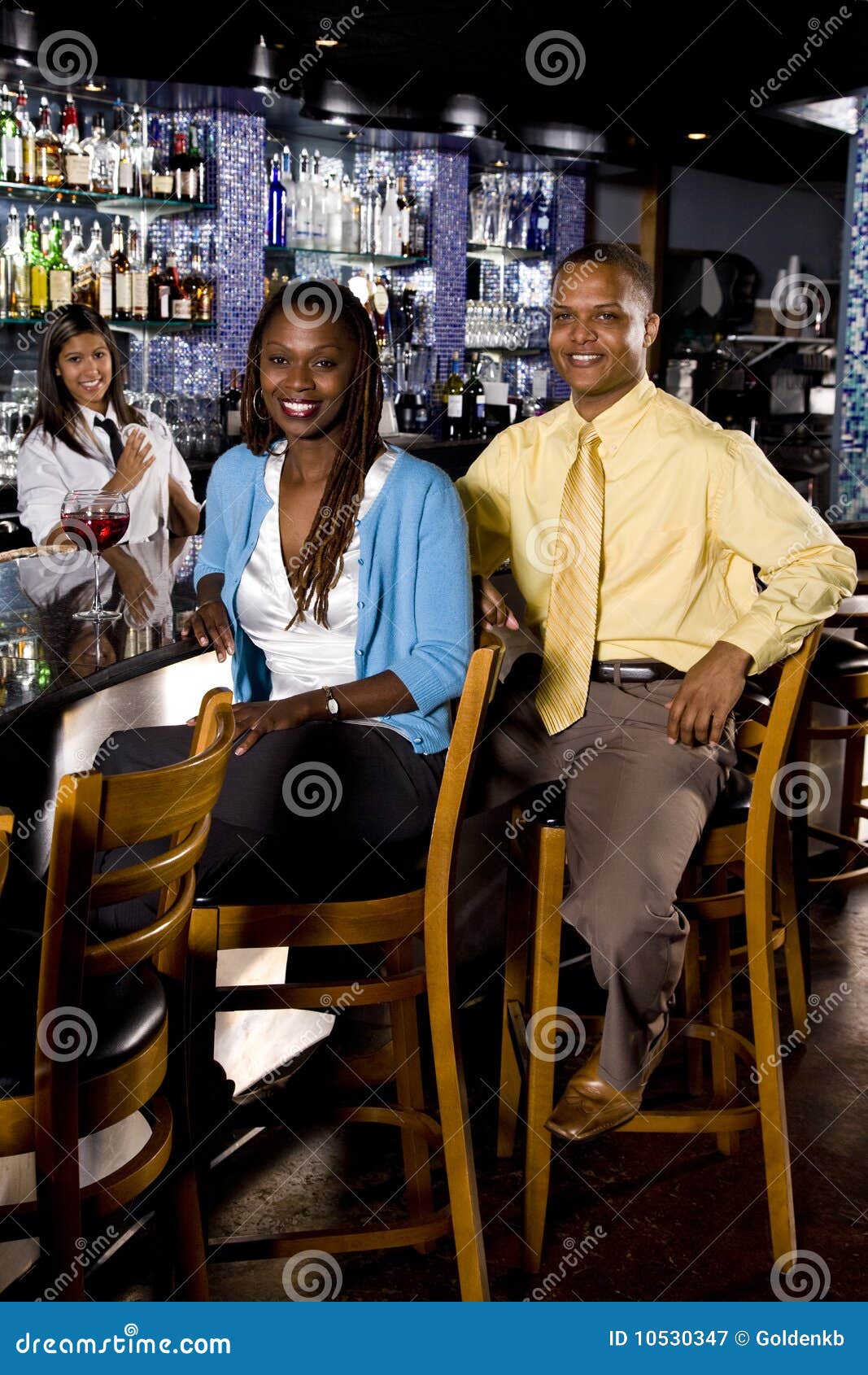African American Couple Sitting at a Bar Stock Image - Image of