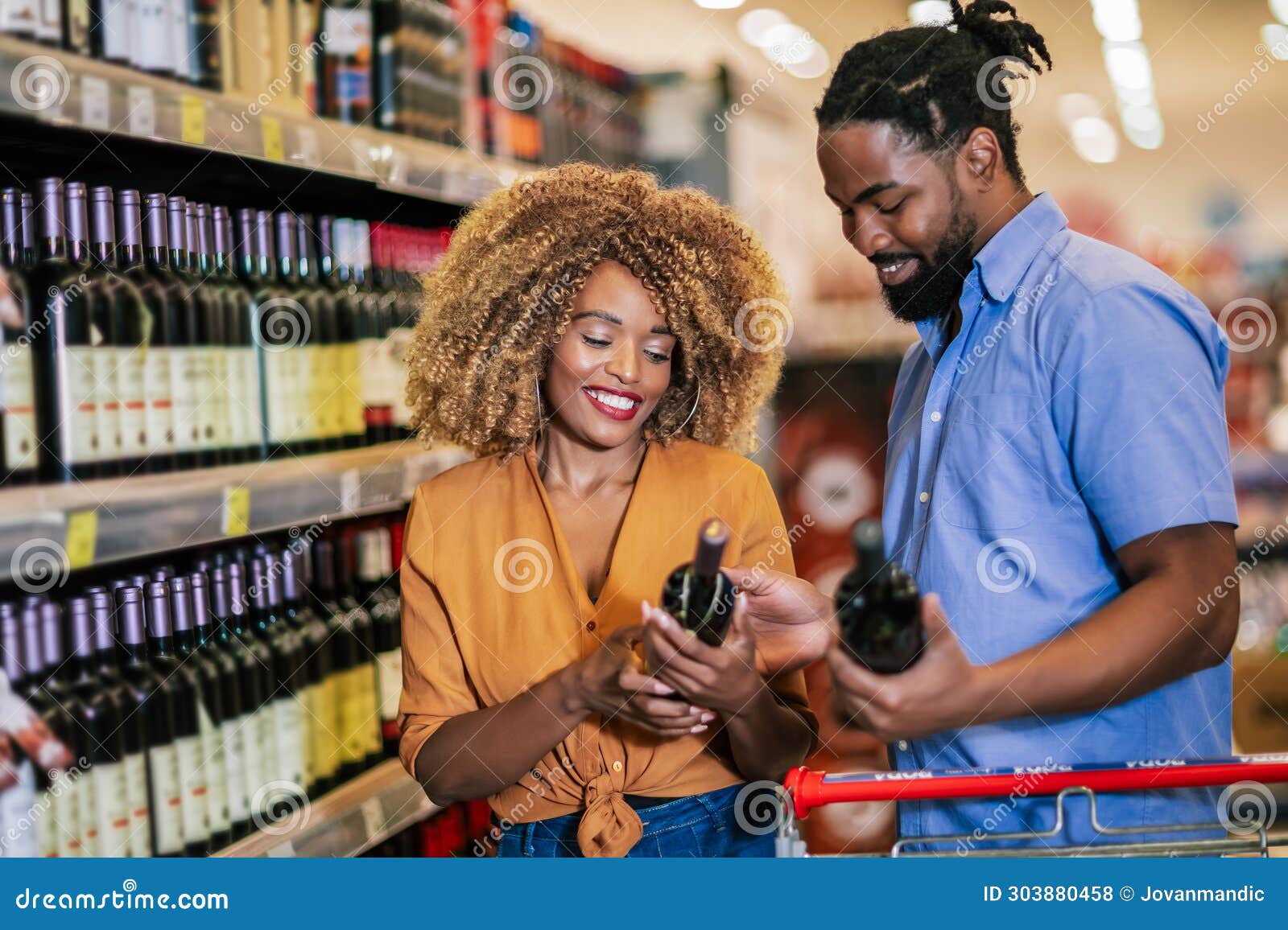 African American Couple with Trolley Purchasing Groceries at Mall ...