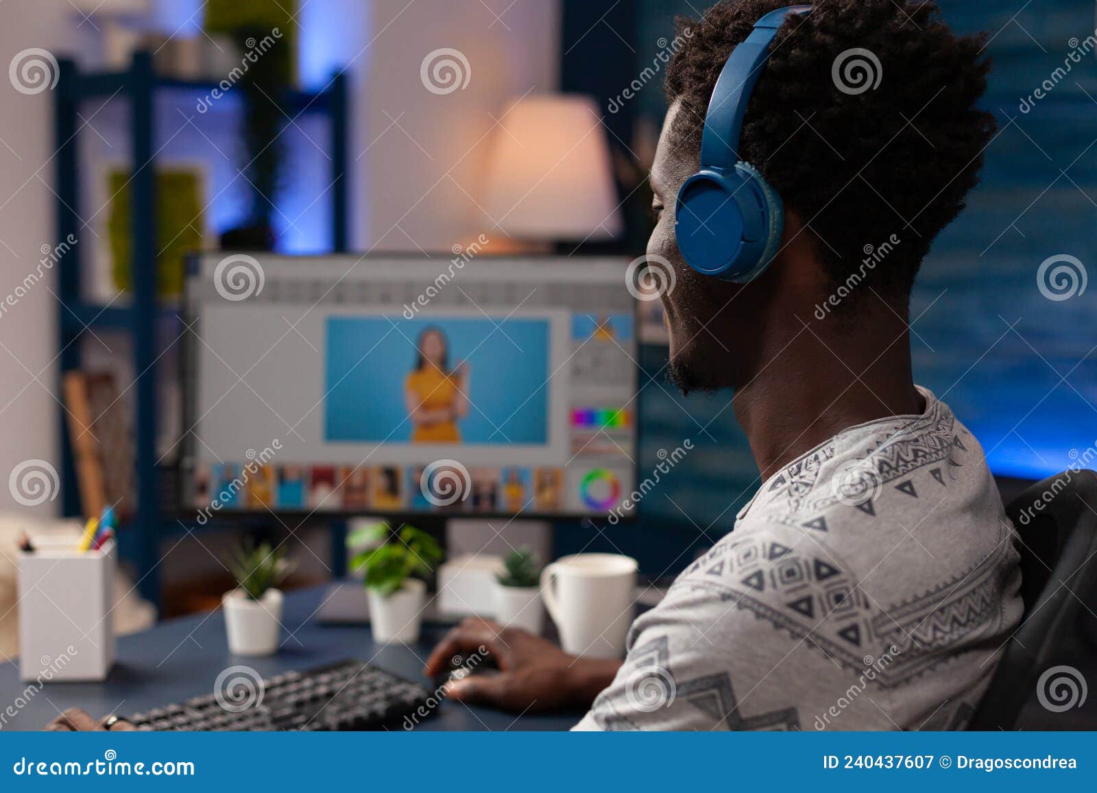 African American Editor Editing Picture Using Retouching Software Stock