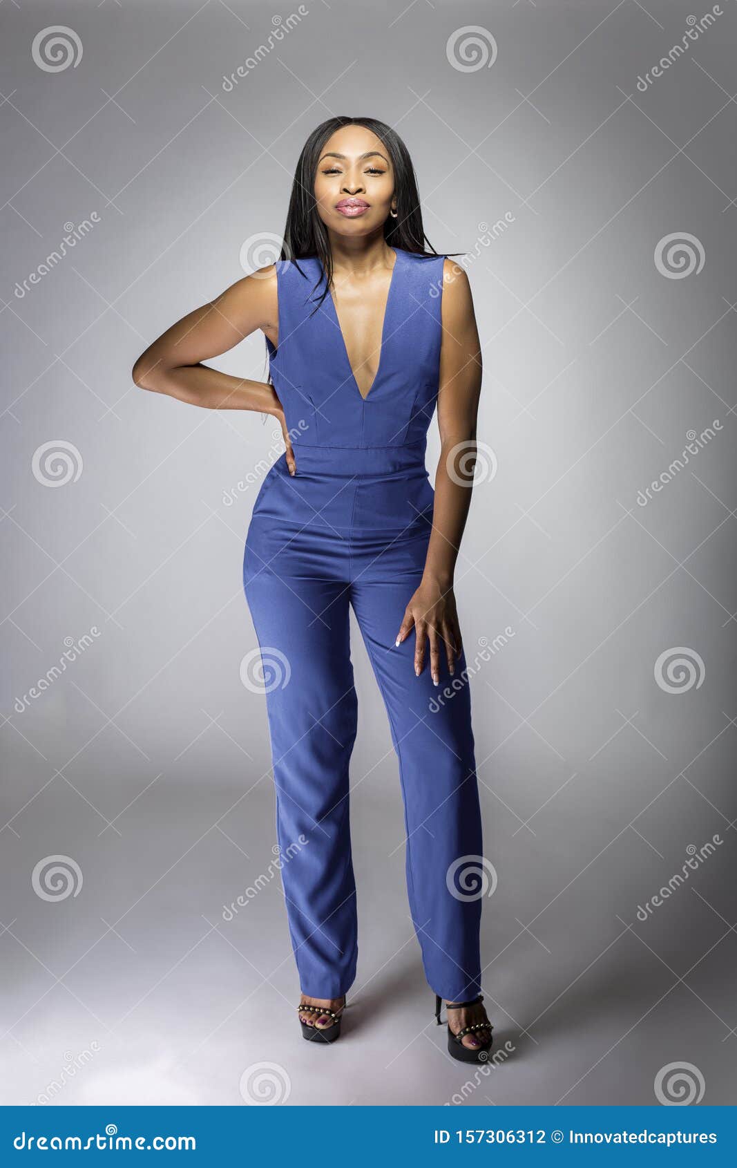 African American Fashion Model Wearing a Blue Jumpsuit Stock Photo ...