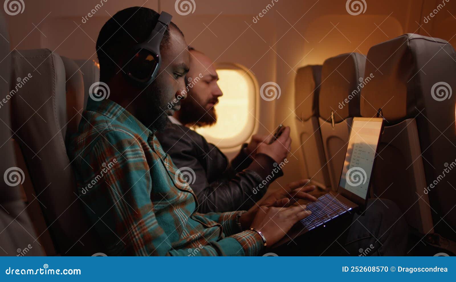 African American Freelancer Using Laptop on Flight Stock Footage