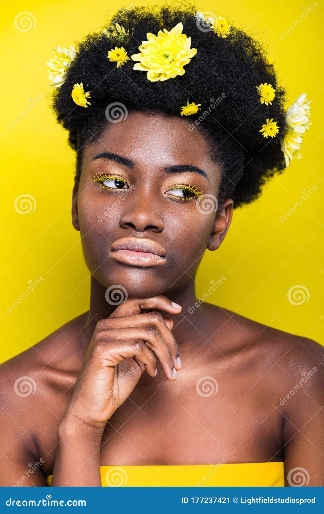 African American Girl With Flowers In Hair Looking Away On Yellow Stock Image Image Of