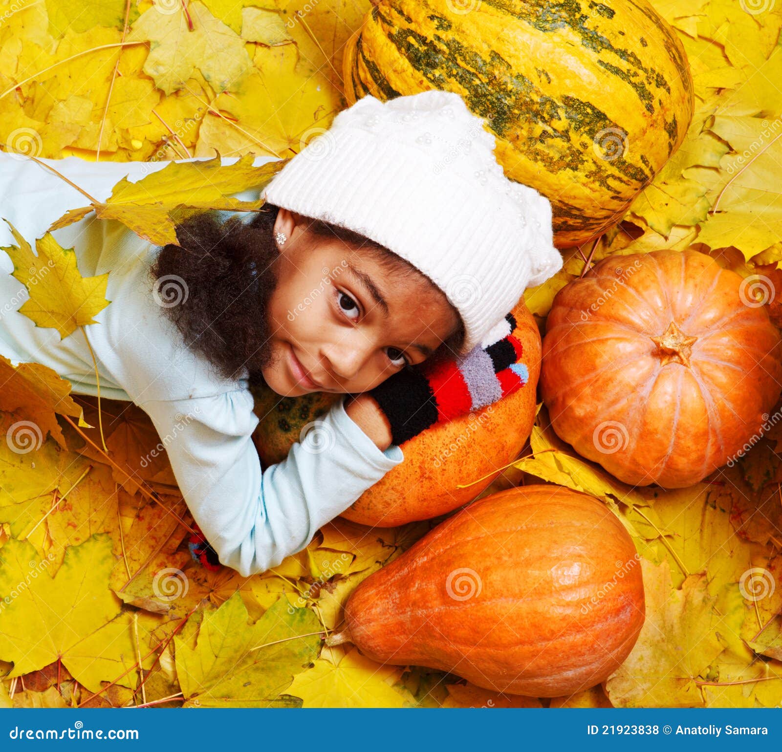 African American Girl Lying on Pumpkin Stock Photo Image of happiness