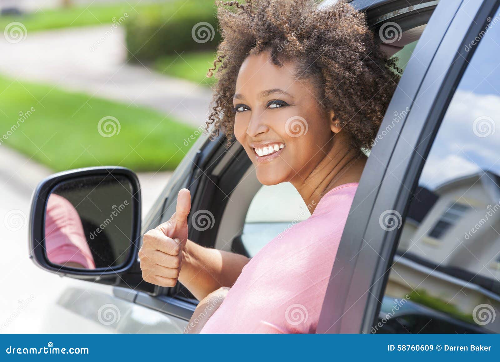 african american girl woman thumbs up driving car