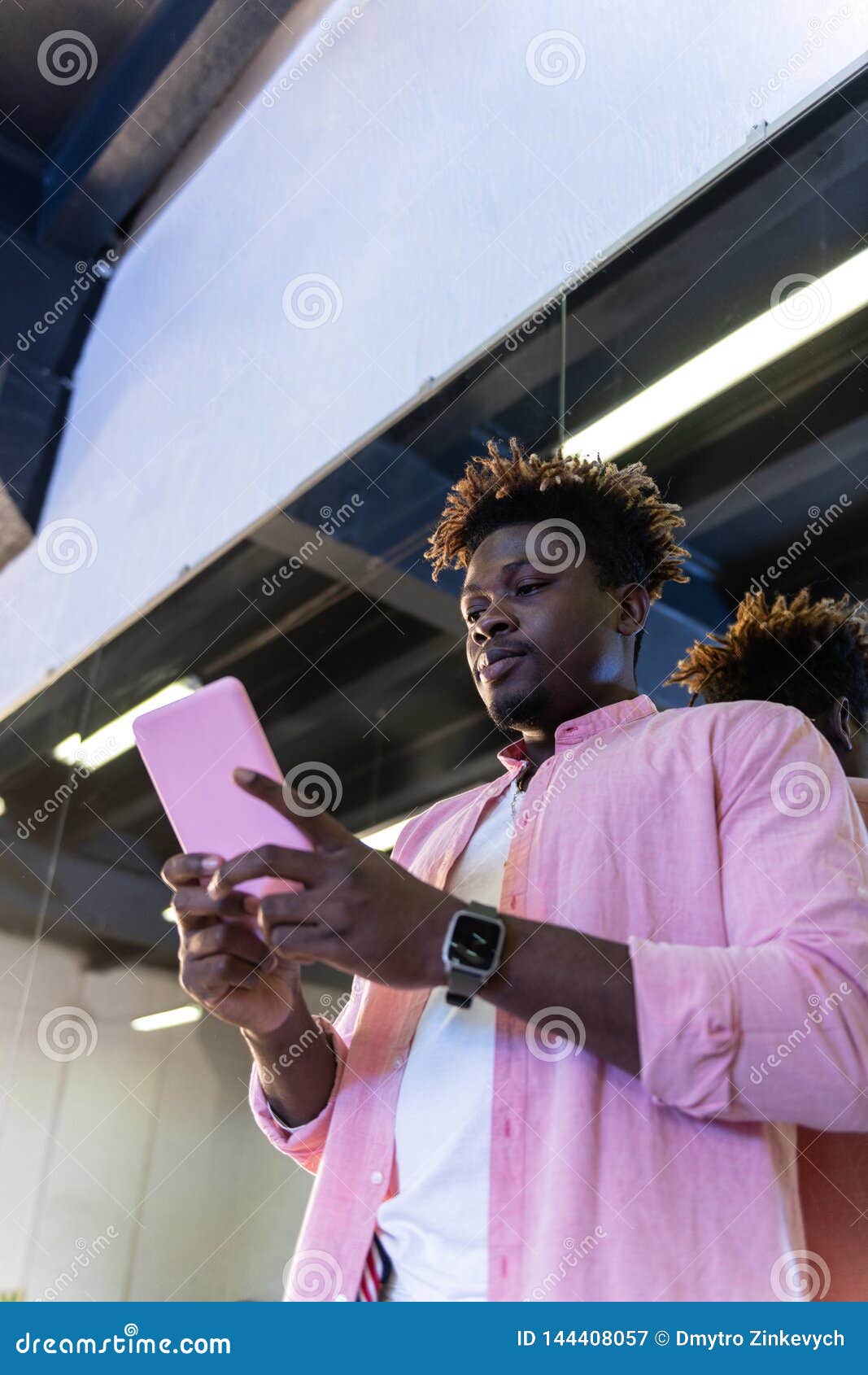 African American Guy in Pink Shirt Carrying Pink Smartphone Stock Image ...