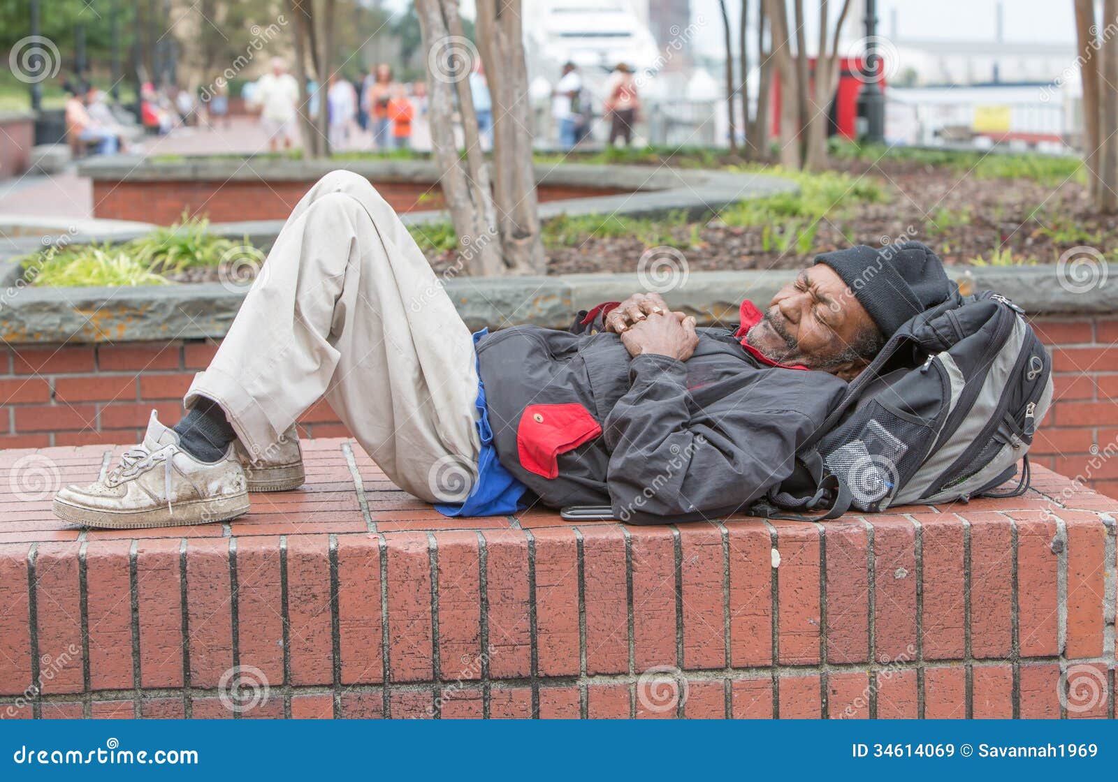 african american homeless man sleeping