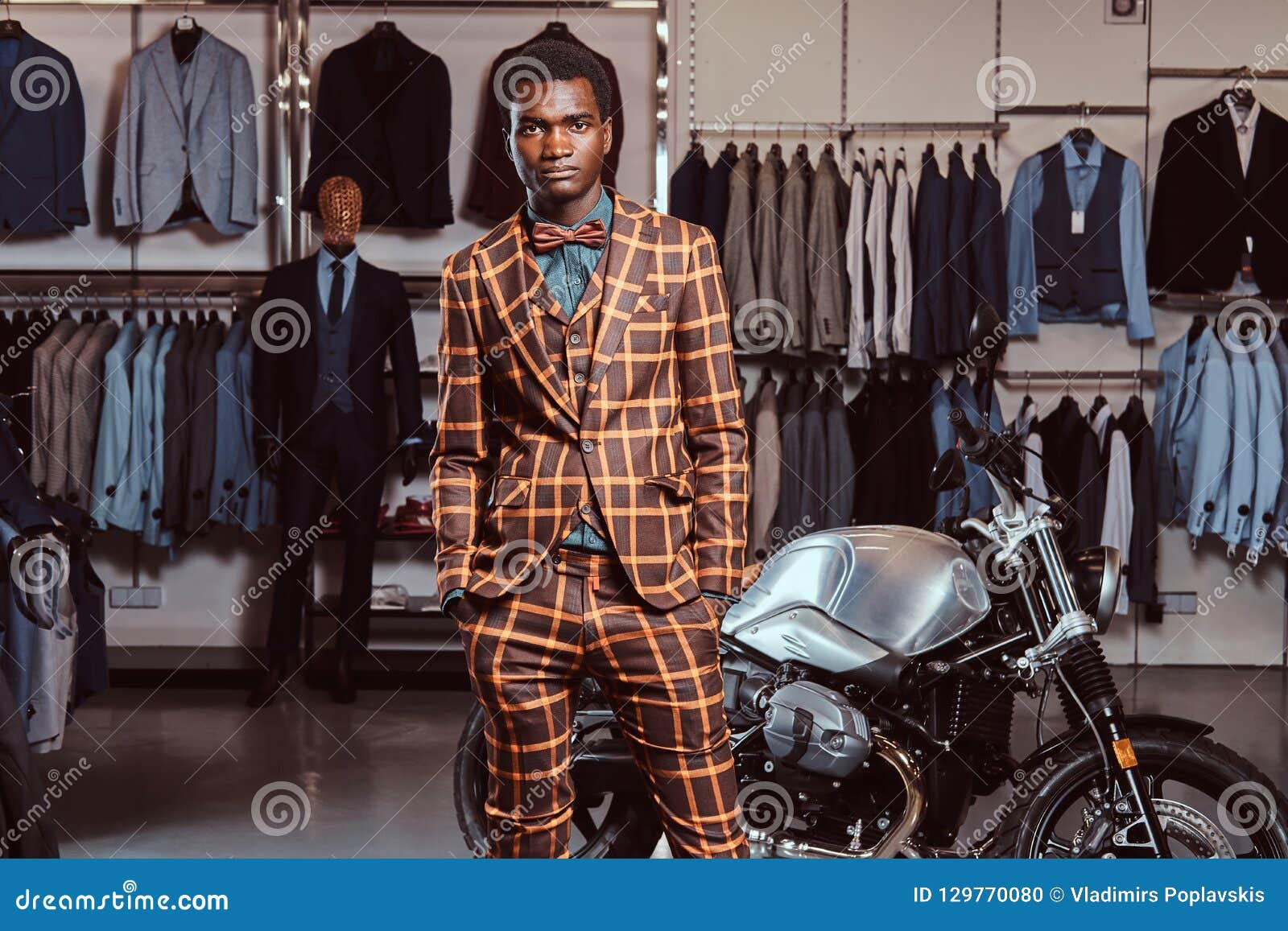 African-American Man Dressed in a Trendy Elegant Suit Posing with Hands ...