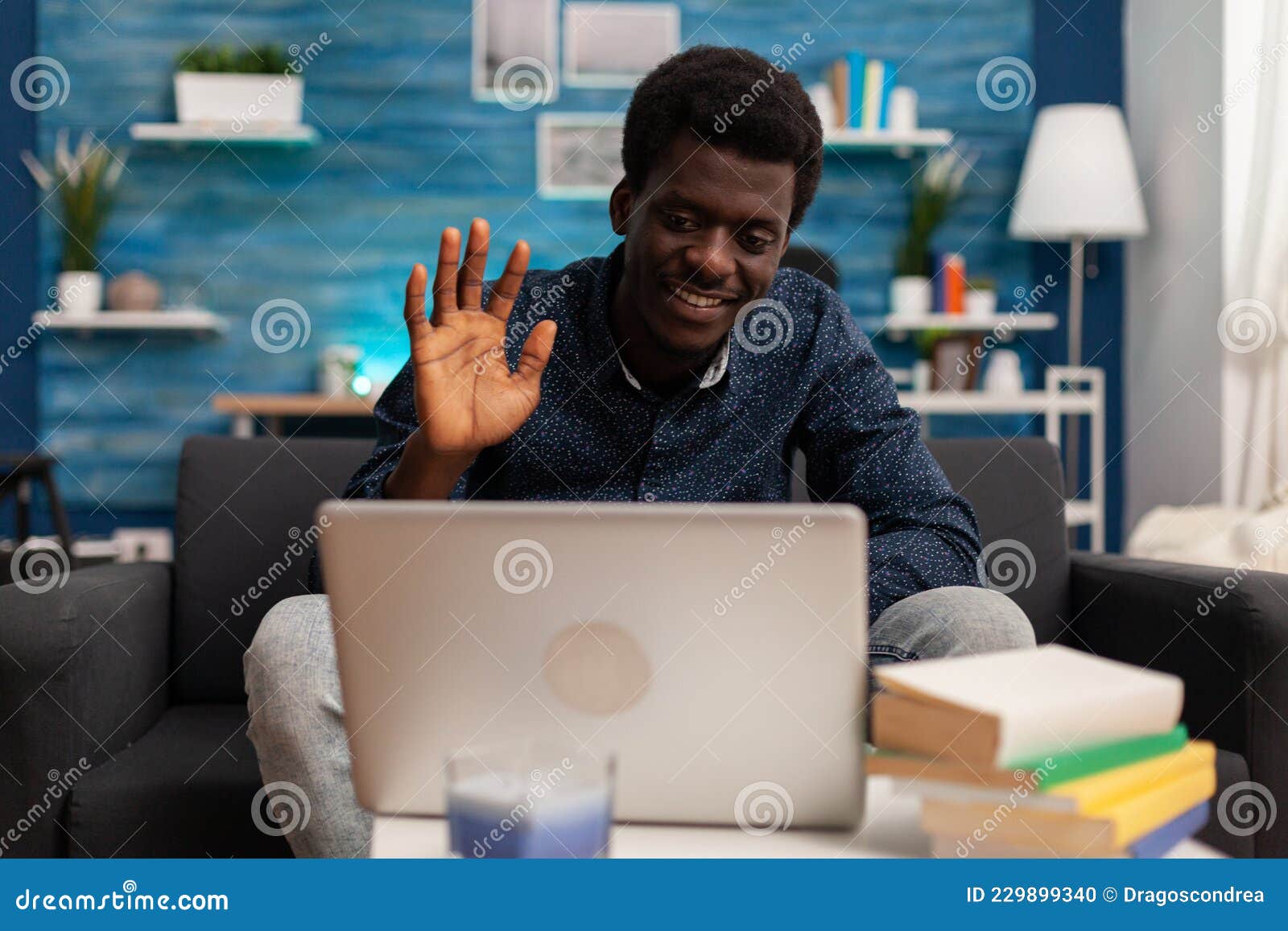 african american man greeting remote collegue during online videocall
