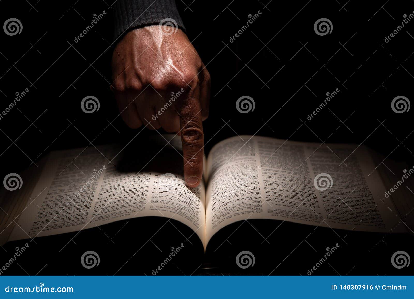 African American Man Pointing To the Bible, the Word of God Stock ...