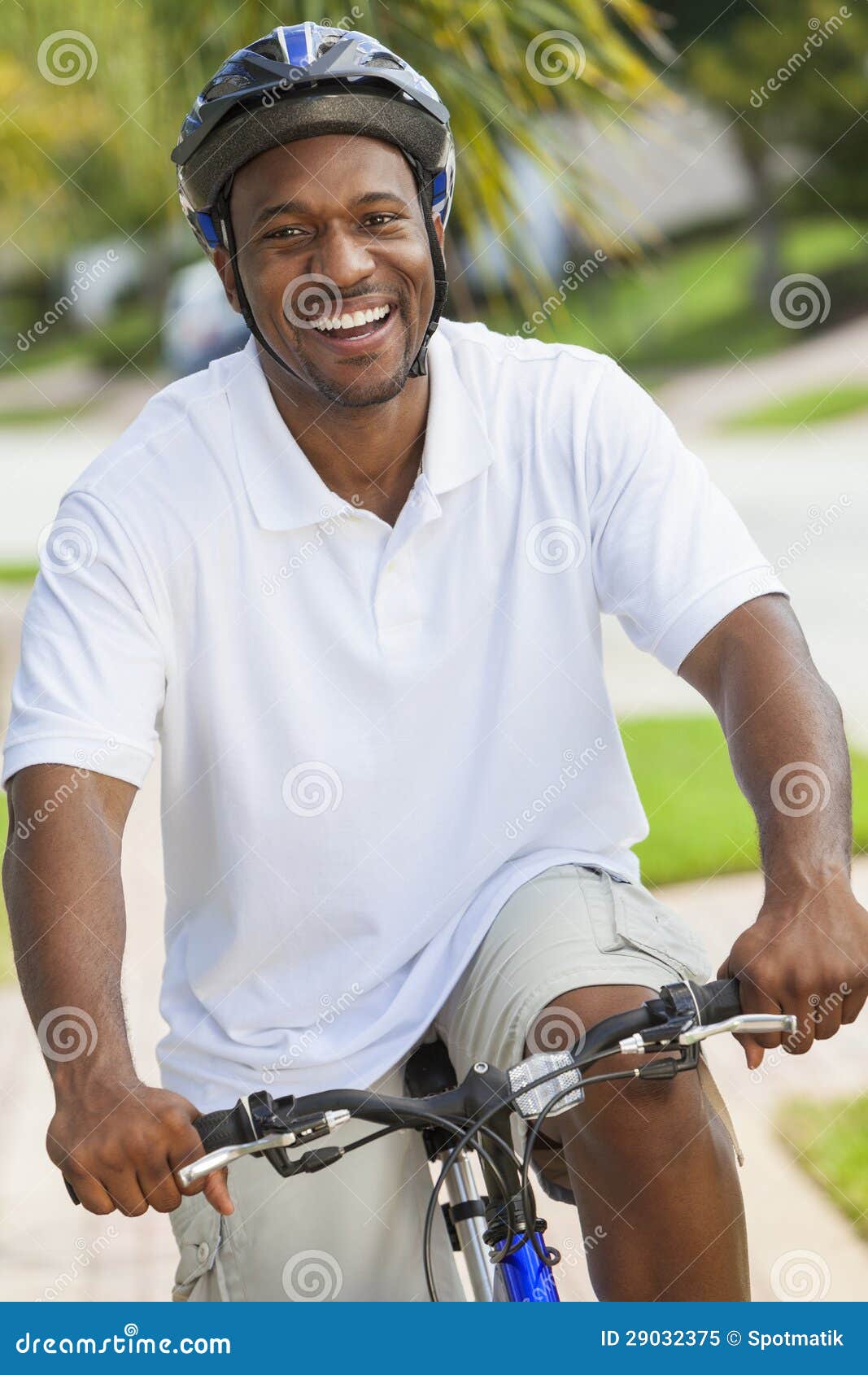 African American Man Riding Bicycle Stock Image - African American Man RiDing Bicycle 29032375