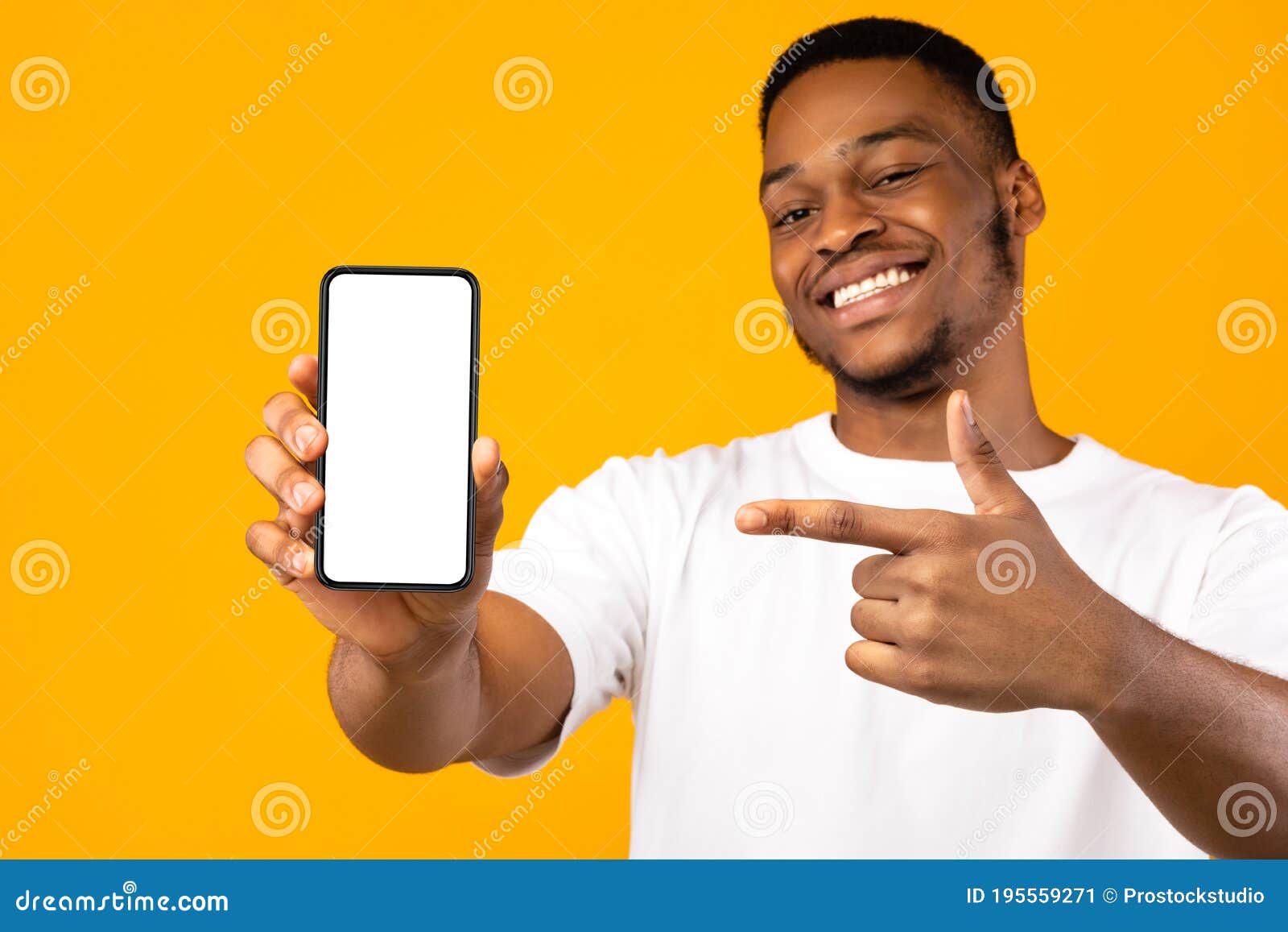 african american man showing mobile phone screen, yellow background, mockup