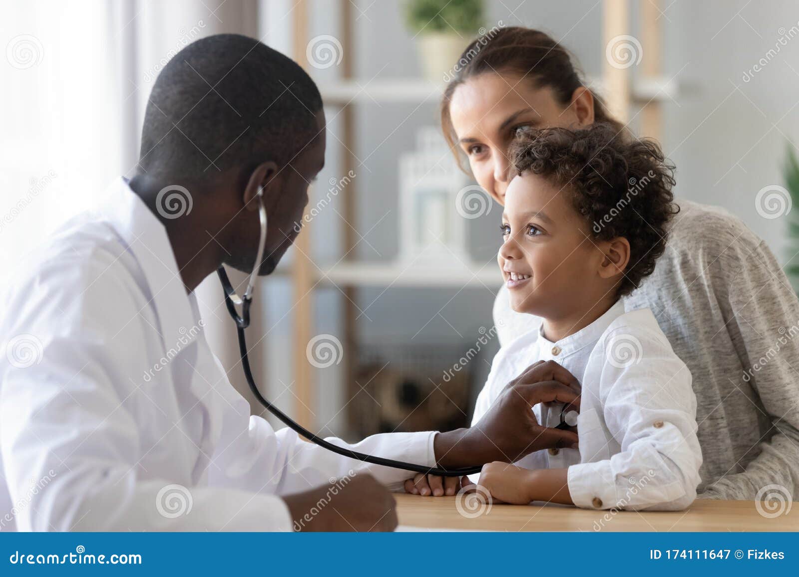 african american pediatrician listening to child lung and heart sound